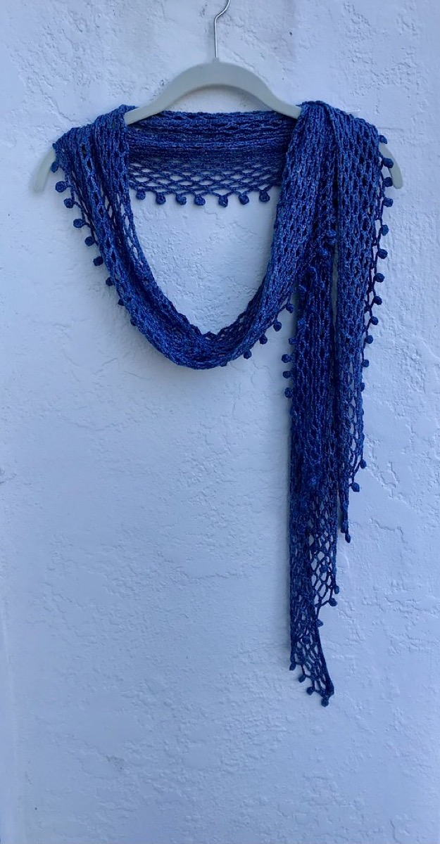Close-up of a hand-rolled silk scarf